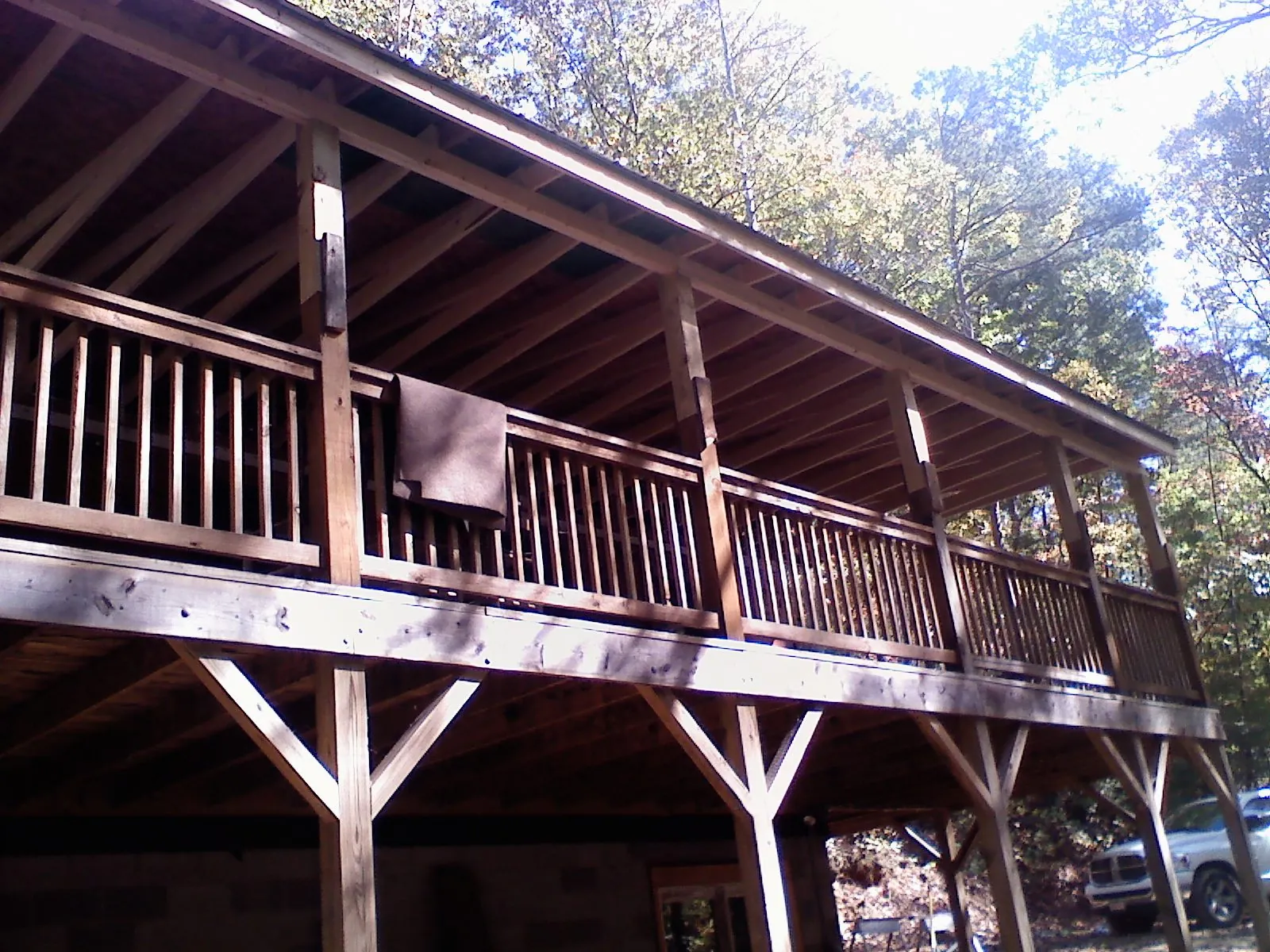 Timber framing under a new elevated porch and deck — Roof Leak Repair in Pitcher by Roofing Brothers